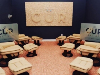 Cur Salt Spa Inc. Large Image Mounted On Wall Spelling Out &Quot;Cur.&Quot;  Bright Room With 6 Cushioned Chairs Around The Room.