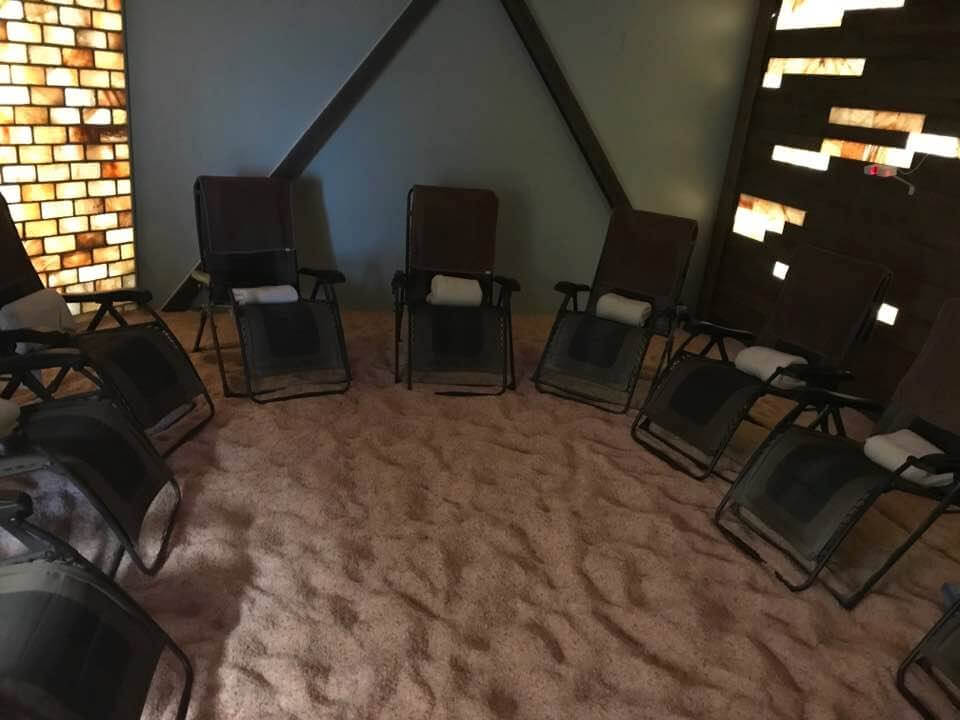 Kansas City Salt Mine. 9 lounge chairs are circled up inside of one salt room.