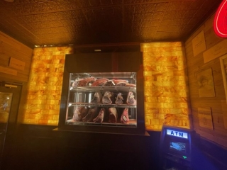 Market Tavern. View Of Freezer With Many Different Cuts Of Meat In It.