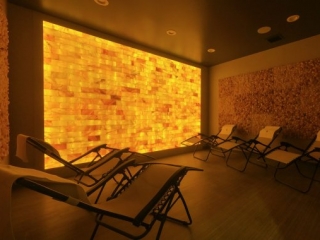 Breathe Salt Vault. Dimly Lit Spa Room Full Of 5 Reclined Lounge Chairs