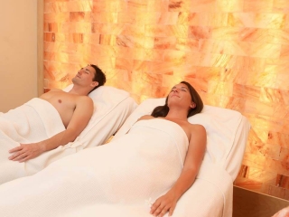 Kaffee'S Garden Spa. A Couple Is Relaxing In Two Massage Beds Next To Each Other.