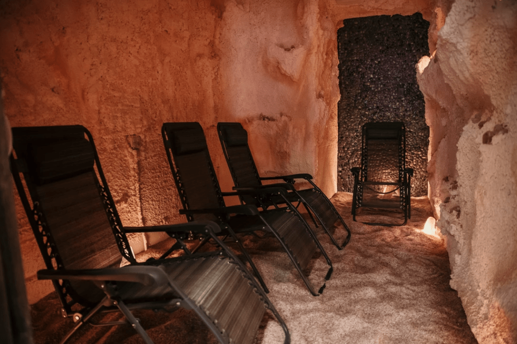 Mark's Salt Cave. 4 lounge chairs inside long salt cave.