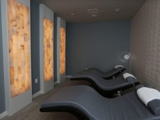 The Sauna Haus. Three Adjustable Beds Lay Next To Each Other In Spa Room.