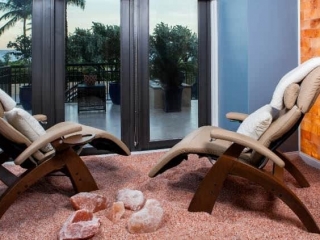 Nspa Delray Beach Marriott. Two Lounge Chairs Sitting In Pink Salt Rocks, Facing The Outside View Of Delray Beach.
