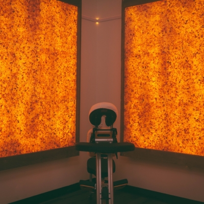 Massage Chair With Two Orange Back Lit Square Panels At The Revelations Holistic Center - Dorval, Quebec, Canada.