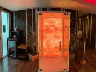 Agua Caliente Resort Casino Spa. Glass salt chamber with pink rock backdrop.