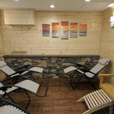 Four Lounge Chairs And A Wooden Bench In A Wooden Room At Salt Haven Therapeutic Salt Room (Fresh Start Chiropractic) In Lock Haven, Pennsylvania