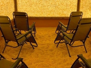 Trade Secrets Skincare. 6 Lounge Chairs Slightly Angled Inward All Facing Forward. Floor Is Completely Covered By Salt.