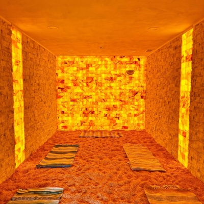 The Salt Room At Akasha Yoga &Amp; Salt In Suwanee, Georgia With Himalayan Salt Bricks On The Walls, Salt On The Floor And Yoga Mats.