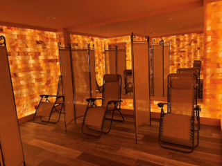 The Salt Room At Anahata Massage In Longmont, Colorado With Three Chairs And A Himalayan Salt Wall.