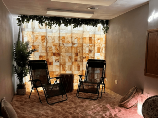 A Salt Room With Chairs And A Himalayan Salt Brick Wall