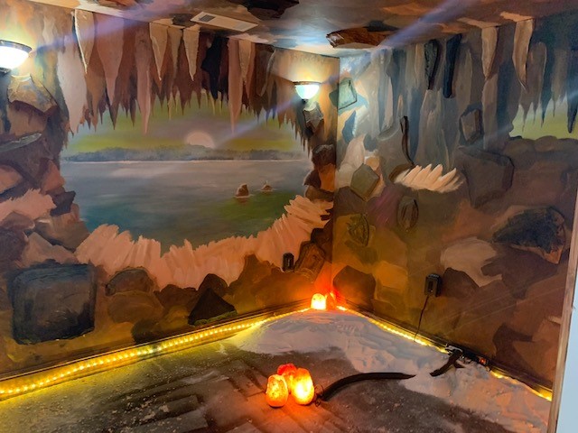 Breast and Body Health Boutique. Cave styled Salt room with outdoor mural painted on walls