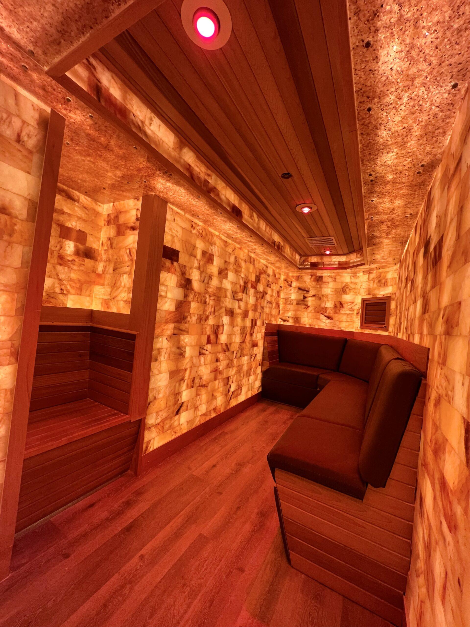 The salt room at Ocean Pacific Gym and Wellness in San Diego, California with a bench and Himalayan salt bricks for a salt wall.