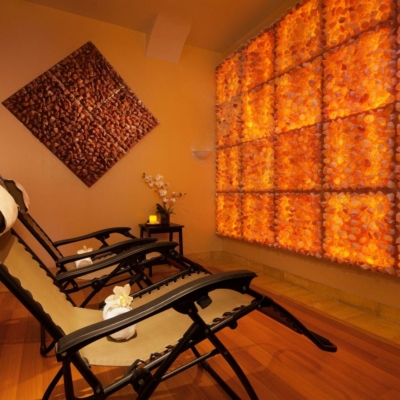 A Salt Room With Two Chairs And Himalayan Salt Panels On The Walls