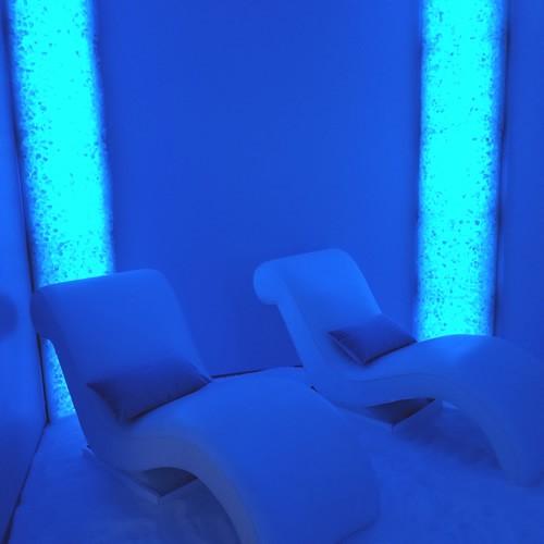 Two Lounge Chairs In A Room With Blue Led Lit Salt Panels In The Background At Seaside Wellness Group In Hobe Sound, Florida