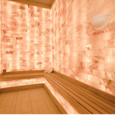 The Salt Room At The Henderson Beach Resort And Spa In Destin, Florida With Benches, Halogenerator And Himalayan Salt Brick Walls.