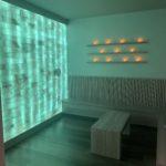 The Woodhouse Day Spa salt room in Atlanta with a HImalayan salt brick wall and benches.