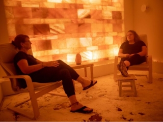 Neurofitness Wellness Center. Two Women Sit And Chat Inside Of A Salt Room.