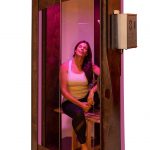 Woman sitting in Salt booth chamber