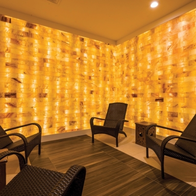 Four lounge chairs surrounded by LED backlit salt panels at the Bergamos Retreat - Friendswood, Texas