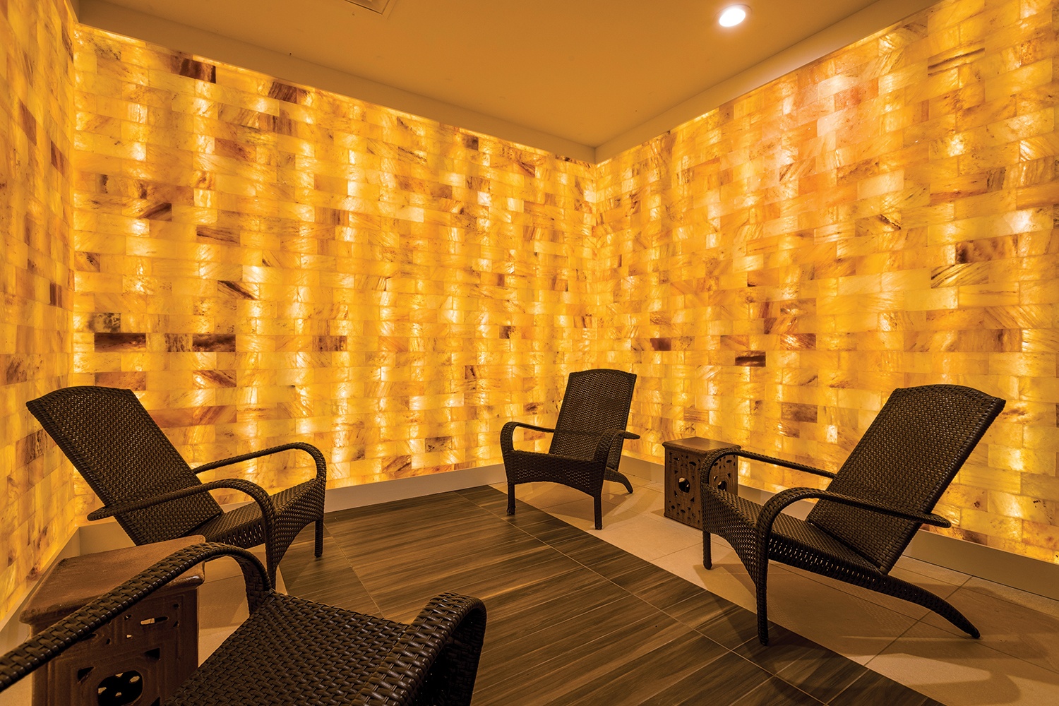 Four lounge chairs surrounded by LED backlit salt panels at the Bergamos Retreat - Friendswood, Texas