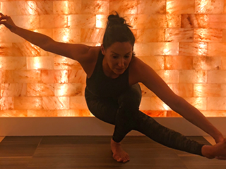 Woman In Front Of A Led Backlit Salt Panel Doing Yoga At The Bergamos Retreat - Friendswood, Texas.