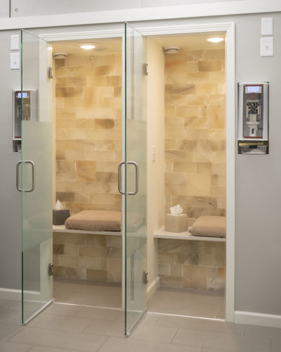 Two Halotherapy Rooms With A Cushioned And Salt Panel Walls At The Breathe Salt And Sauna - Johnson Creek, Wisconsin.