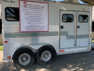 A Mobile Silver Star Trailer With A Banner That Reads &Quot;Salt Chamber, Pioneers Of Equine Salt Therapy&Quot;