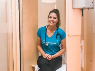 A Smiling Woman Sits In A Salt Booth At Cryomedspa Wellness In Durango, Co
