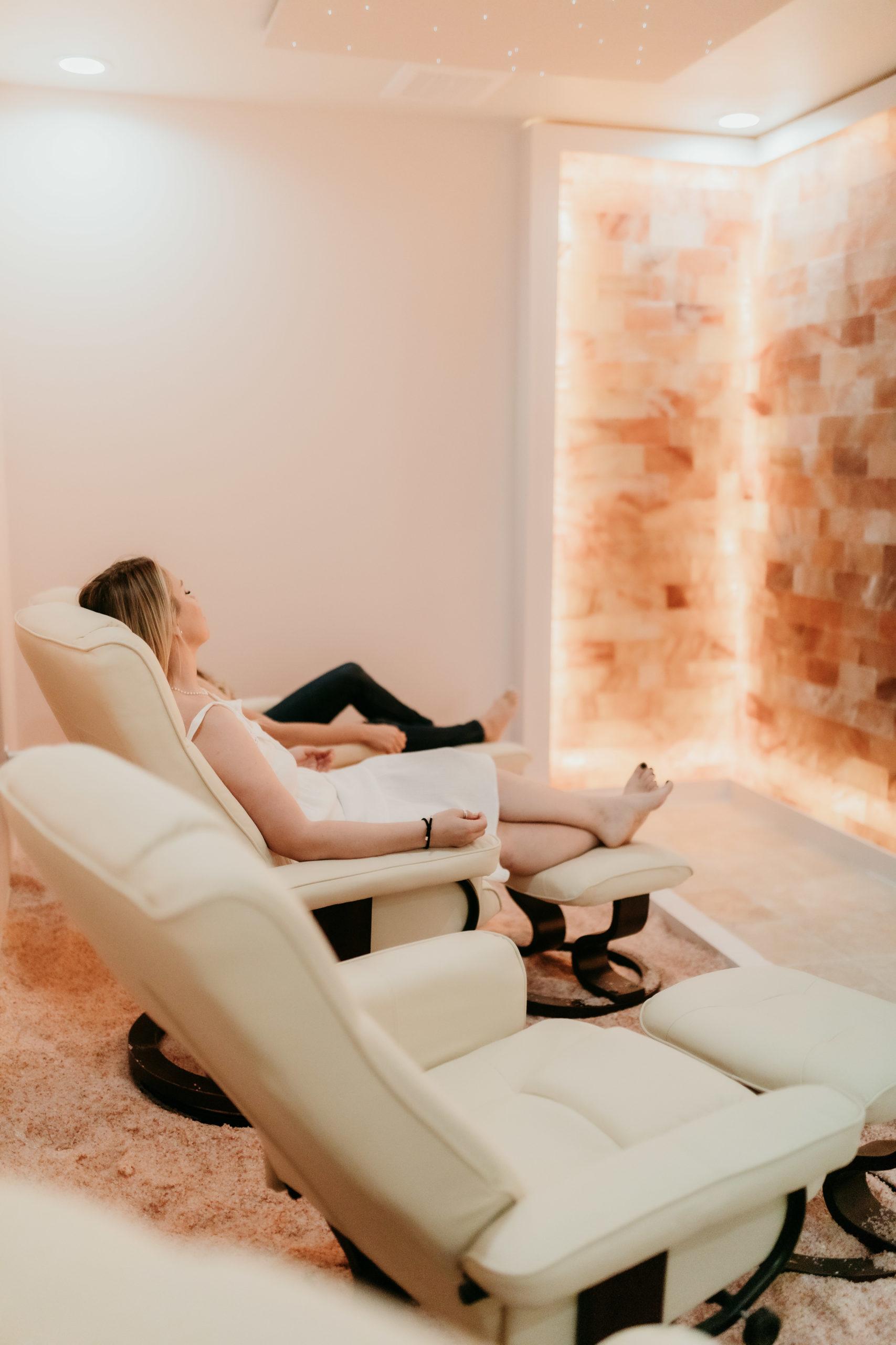 Woman Relaxing In Salt Meditation Room