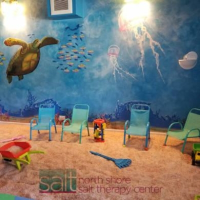 Children'S Salt Room With Aquatic Mural On The Wall And Toys In Floor Salt At North Shore Salt Therapy Center In Highland Park, Illinois.