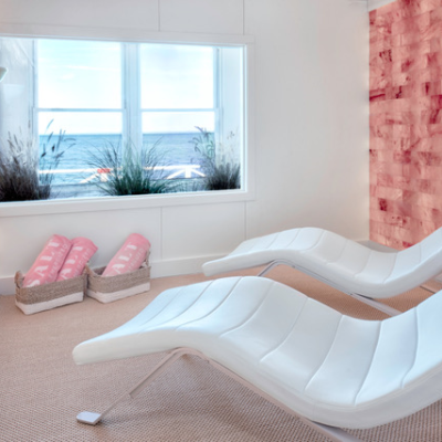 Two White Chaises In A Bright Room With Two Salt Stone Walls At The Salt Live Energize At The Sound View In Greenport In Long Island, New York