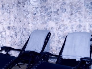 Two Dark Blue Lounge Chairs In Front Of A Salt Panel Wall At The Nordic Edge In Eastchester, New York
