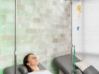 Women Relaxing In A Curvalounger By Oakworks While She Receives Iv Therapy In A Salt Room