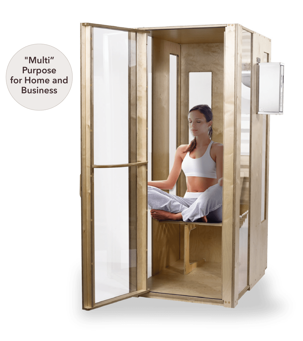 Woman sitting in a meditaiton posture in Salt booth chamber