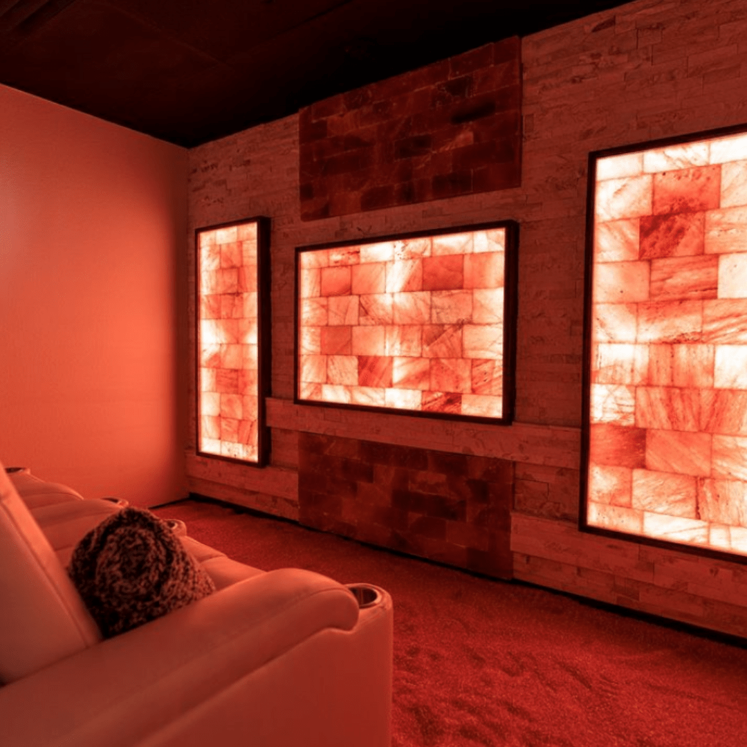 A Salt Room With A Chair And A Himalayan Salt Wall.